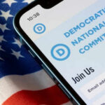 Phone screen displaying Democratic National Committee website.