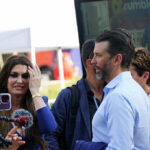 Group of people talking at an outdoor event