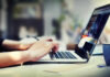 Person typing on laptop at a desk