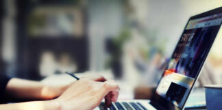 Person typing on laptop at a desk
