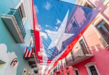 Puerto Rico flag canopy over colorful colonial street