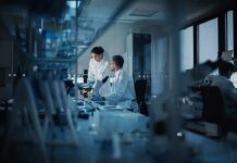 Grant Guillotine Hits Lifesaving Research Scientists working in a modern laboratory
