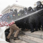 Transparency Win Torpedoes J6 Blur Tactics Police vehicle parked in front of the Capitol building