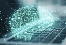 Trump’s Pentagon Supercharges AI War Tech digital brain hologram over a laptop keyboard