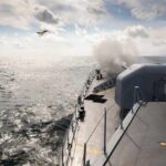 Naval ship firing a weapon into the ocean with a plane flying overhead