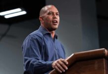 Man speaking at a podium