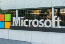 Microsoft logo displayed outside a modern office building