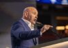 Major UFC Blunder — White Goes Nuclear Blurred view of a boxing ring surrounded by a cheering crowd