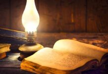 Hidden Journal Targets Unnamed Predators Open antique book beside a glowing oil lamp