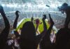 Banned-Or-Not? Pacquiao Tests FIFA Nerves Fans cheering in a packed stadium during a night game