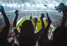 Banned-Or-Not? Pacquiao Tests FIFA Nerves Fans cheering in a packed stadium during a night game