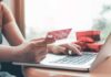 Religion Whiplash: Jesus Rejected, Allahu Akbar OK? Person holding credit card while typing on laptop
