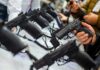 Handgun Reality Upends Rifle Panic Handguns on display at a store counter