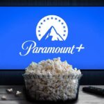 Antitrust Standoff Triggers Paramount Escape Plan Glass bowl of popcorn in front of Paramount+ on TV