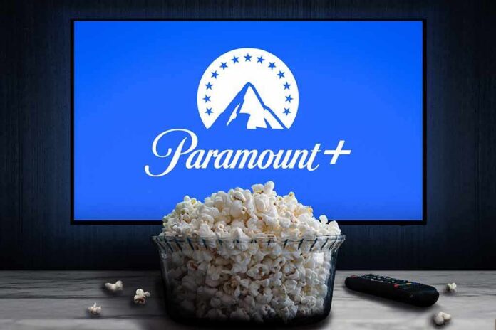 shutterstock_2166969557 Glass bowl of popcorn in front of Paramount+ on TV