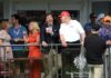 Punishment Equals Truth? Critics Torch Tucker Group of spectators on a balcony at a golf event