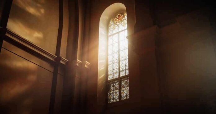 sunlit stained glass window in a church interior