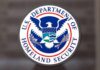 U.S. Department of Homeland Security seal on a glass surface