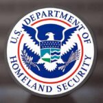 Bureaucratic Trap Shreds DACA Promise U.S. Department of Homeland Security seal on a glass surface