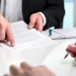 Forged Deeds Exposed—Arizona Strikes Back hands reviewing and pointing at a contract