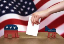 Election Takeover? Martial Law Murmurs Hand casting ballot between Republican elephant and Democratic donkey