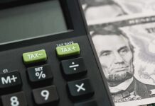 City’s Name-And-Shame List GUTTED – Mass Tax Notices TORCHED Calculator with tax buttons beside U.S. currency
