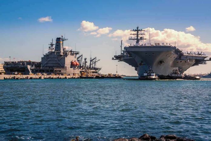 Aircraft carrier and support ships docked at a naval harbor