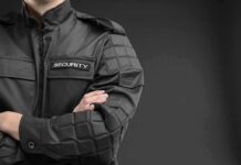 security guard in black uniform with crossed arms