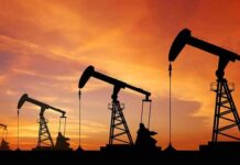 Huge Tariff Threat Puts India on Edge oil pumpjacks silhouetted at sunset