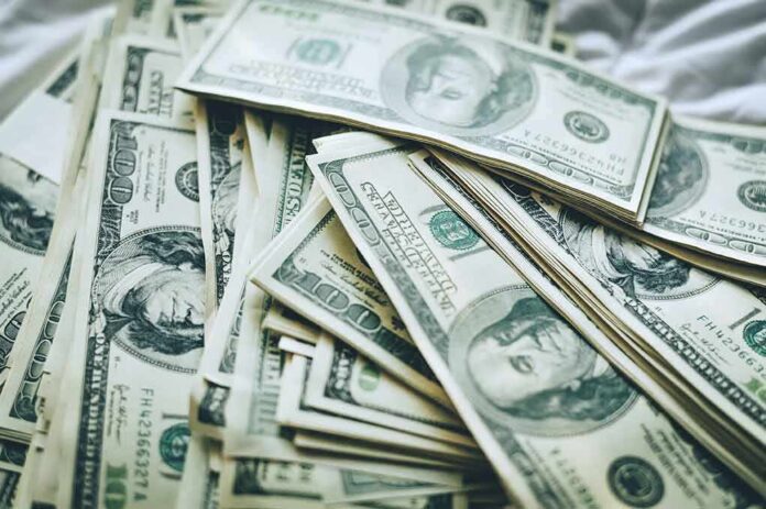 shutterstock_1155217153-1 Stacks of U.S. hundred-dollar bills