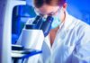 AI Hype Backfires: CRISPR Look‑Alike, No Proof Scientist using a microscope in a lab