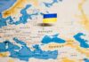 Ukraine flag pin on a map of Eastern Europe