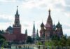 Saint Basil's Cathedral and Kremlin towers under a cloudy sky