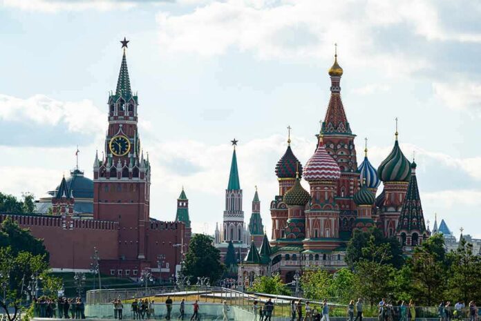 Saint Basil's Cathedral and Kremlin towers under a cloudy sky