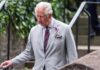 Grief Fight Engulfs Palace – Memoir Landmine Targets Charles older man in a light gray suit walking outdoors