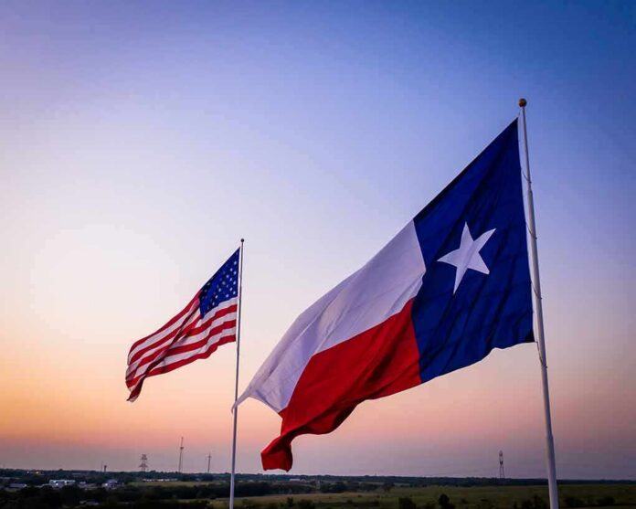 shutterstock_1614044917 Texas and United States flags waving at sunset
