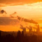 Energy Shock: EPA Yanks Carbon Limits Power plant cooling towers emit smoke at sunset