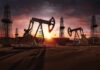 Oil Artery Hit – Cross-Border Drones Rattle Saudi Arabia Oil pumpjacks and derricks at sunset in a desert field
