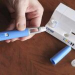 China Pipeline? Ozempic Scam Unmasked Hands assembling a blue insulin pen with packaging on a table