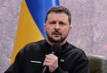 man holding a microphone during a talk