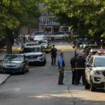 Autopsy Twist Triggers Jackson Man’s Arrest Police officers secure a residential street with patrol cars and yellow tape