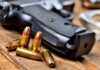D.C. Gun Laws Nail Deployed Guardsman Handgun with scattered bullets on wooden surface