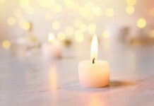 white tealight candle with soft flame