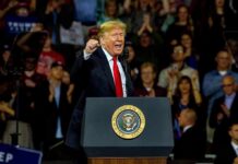 Win Congress, Get $5K – Or Get Burned? Donald Trump speaking at a rally behind a presidential podium