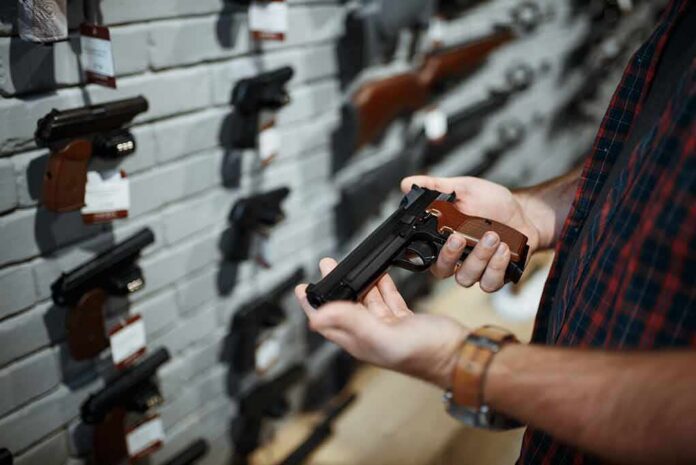 Person holding a handgun in a gun shop
