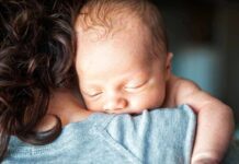 Born Alive – No Rescue? Planned DNRs Before Birth Newborn baby sleeping on an adult's shoulder