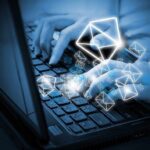 Texas Black Bars Hide Musk – Abbott Dealings Hands typing on a laptop keyboard with floating email icons