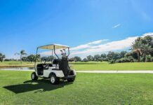 golf cart parked on a sunny golf course