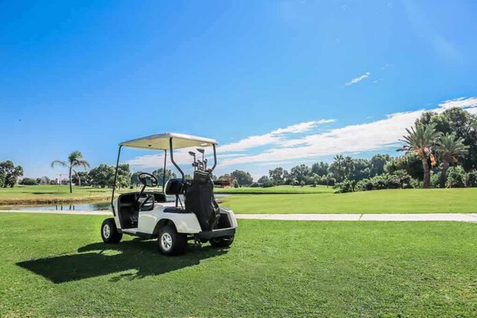 golf cart parked on a sunny golf course